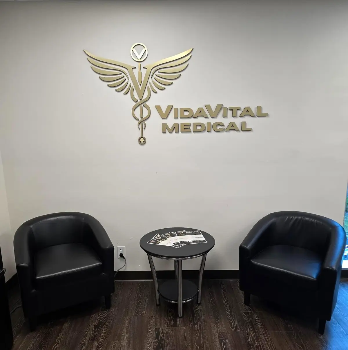 VidaVital Medical clinic waiting area with branded gold logo